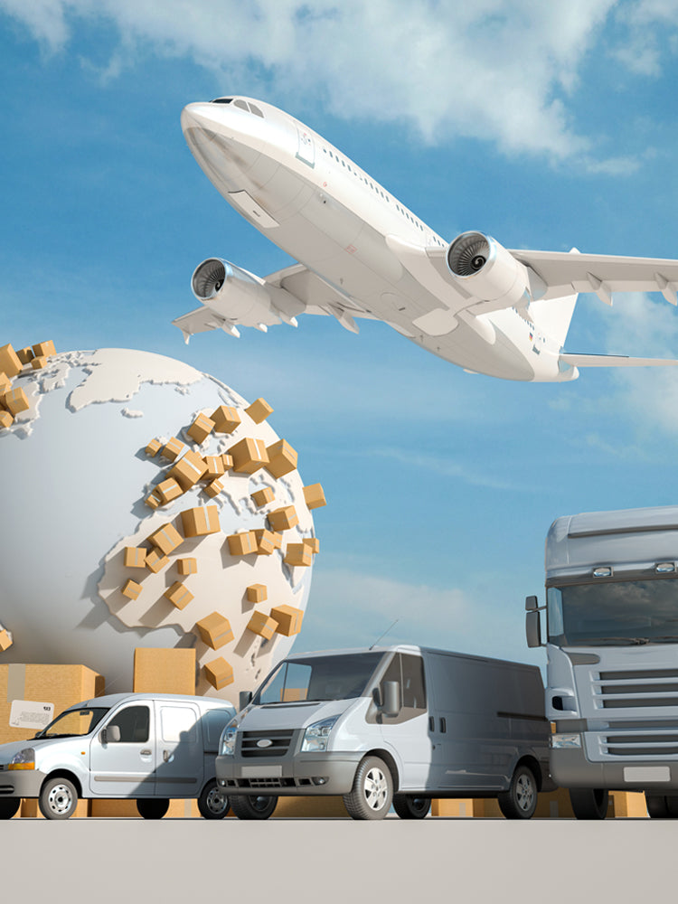 Globe with cardboard boxes, airplane, van, and truck against a blue sky.
