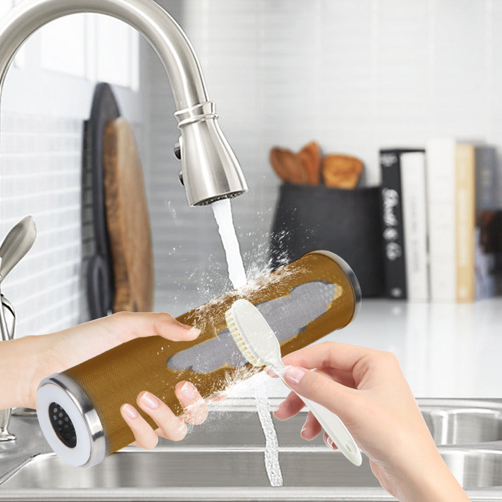 Cleaning Amwater wire mesh reusable sediment filter cartridges with a brush under running water in a kitchen sink.