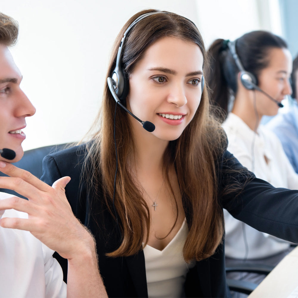Woman in a call center with colleagues in the background